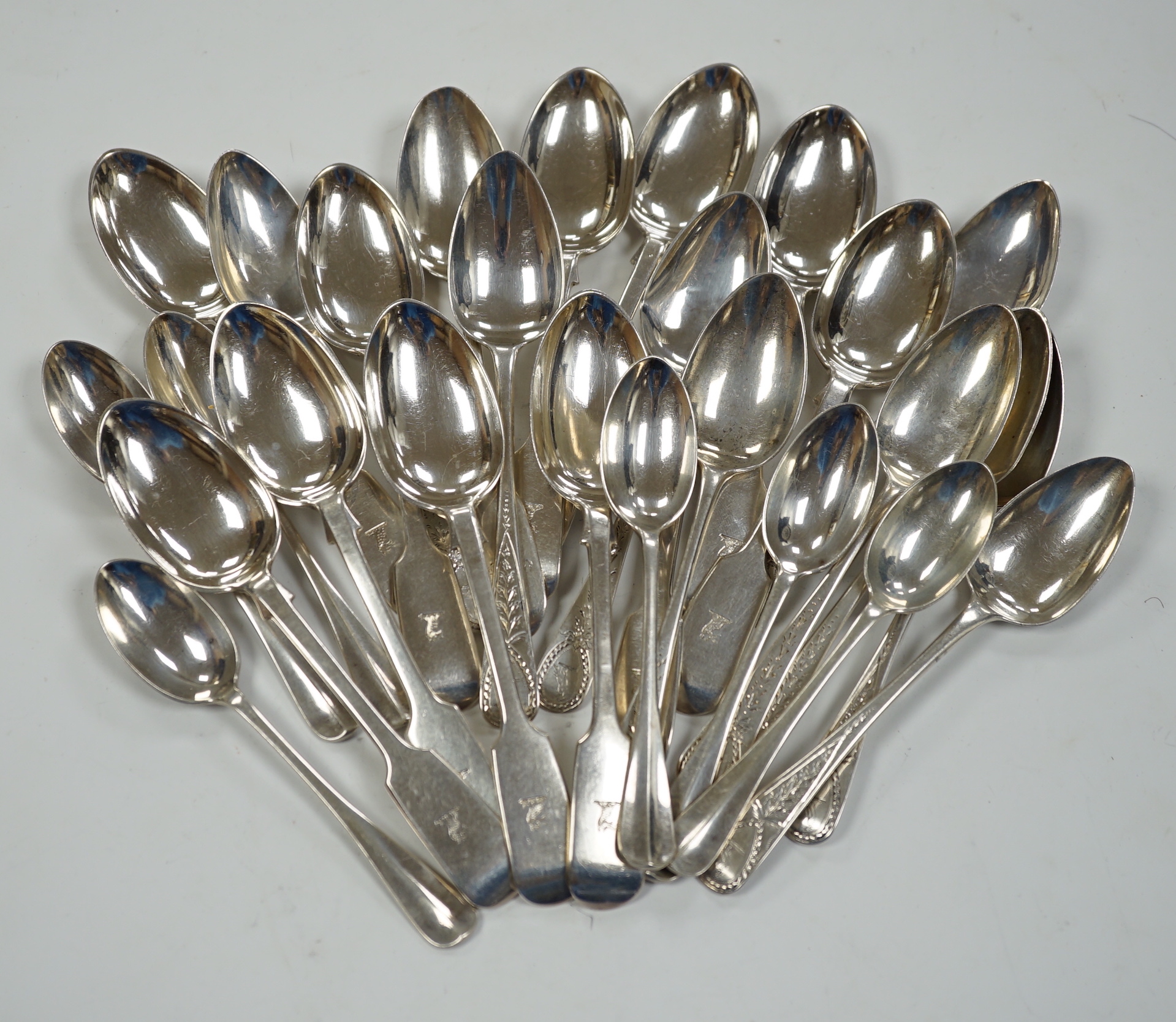 A set of eleven late Victorian silver fiddle pattern teaspoons, London, 1892 and sixteen earlier assorted silver teaspoons, 15.4oz.